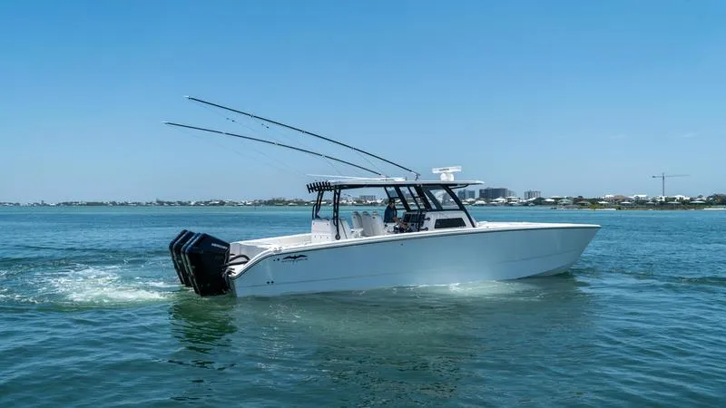 Slide: The Image of 2024 Invincible 40' Catamaran cruising on a sunny day. - 7