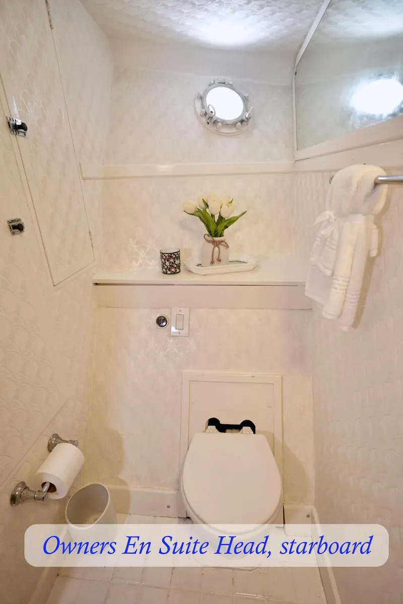 Slide: The Image of Elegant yacht bathroom with porthole and white decor. - 23
