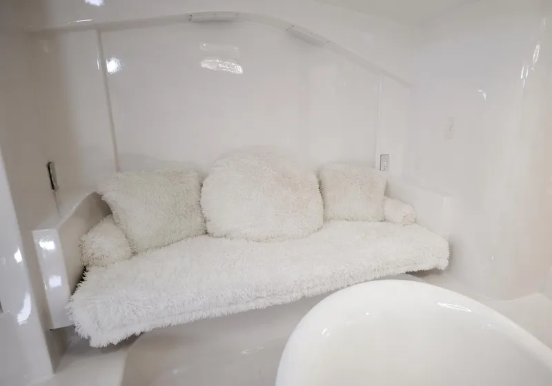 Slide: The Image of Luxurious white couch in a 1945 Custom Motor Yacht. - 29