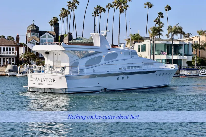 Slide: The Image of Luxurious 1945 custom motor yacht in harbor with palm trees in background. - 3