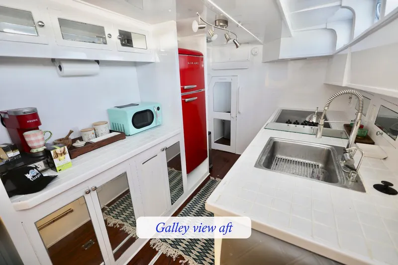 Slide: The Image of Galley of a 1945 Custom Motor Yacht with modern appliances. - 36