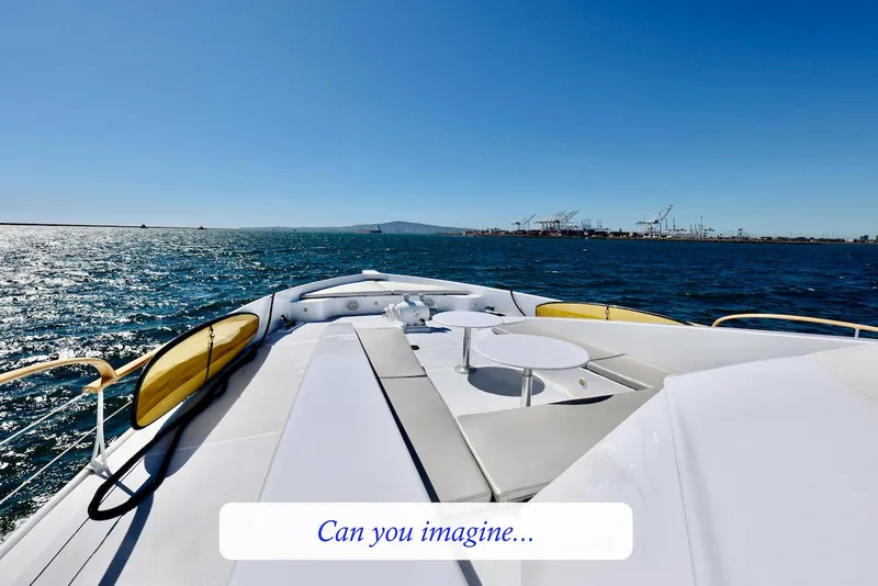Slide: The Image of 1945 custom motor yacht cruising on open sea under clear skies. - 5