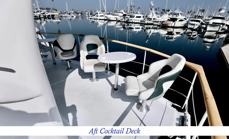 Slide: The Image of Aft cocktail deck on a 1945 custom motor yacht in harbor. - 8
