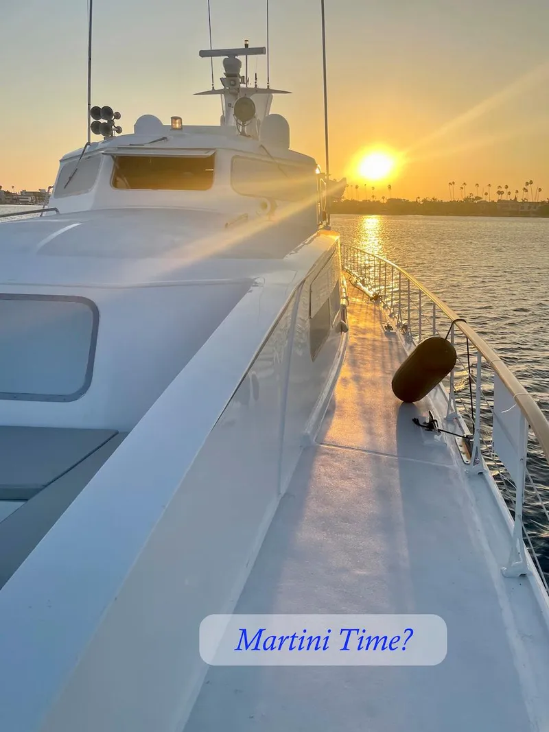 Slide: The Image of Luxury yacht at sunset, text: "Martini Time?" - 9