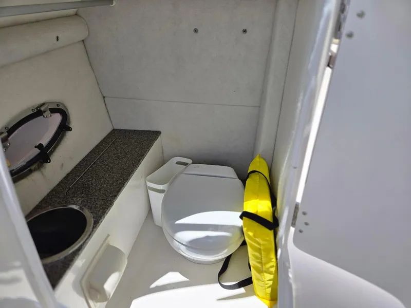 Slide: The Image of 2021 Chaparral 230 boat interior with toilet and sink. - 6