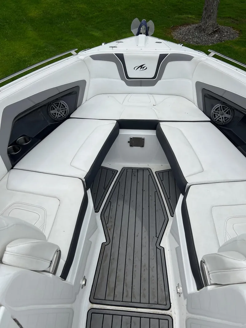 Slide: The Image of 2016 Monterey 328SS boat interior with white seating and black accents. - 10