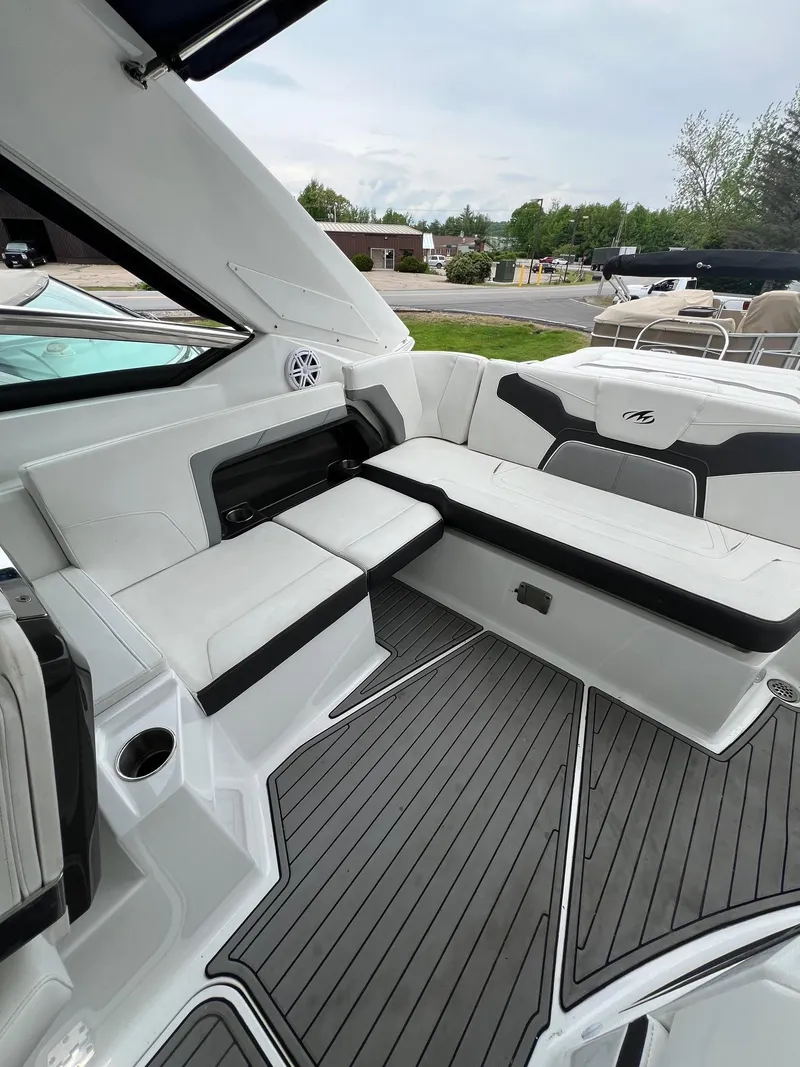 Slide: The Image of 2016 Monterey 328SS boat interior with white and black seating. - 14