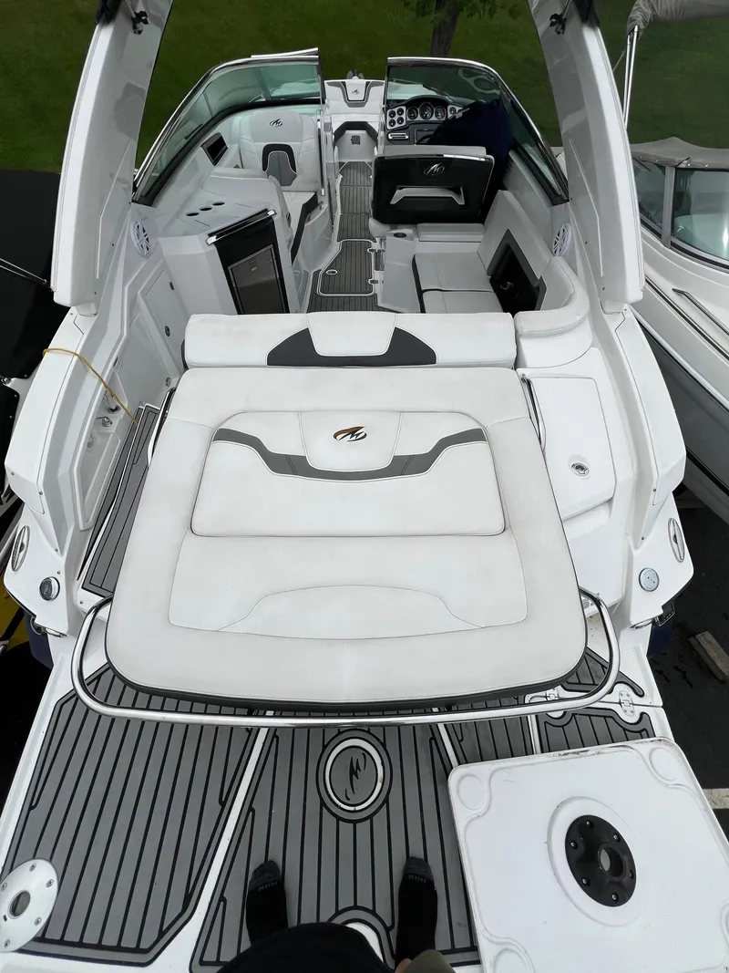 Slide: The Image of 2016 Monterey 328SS boat interior with white seating and modern amenities. - 16