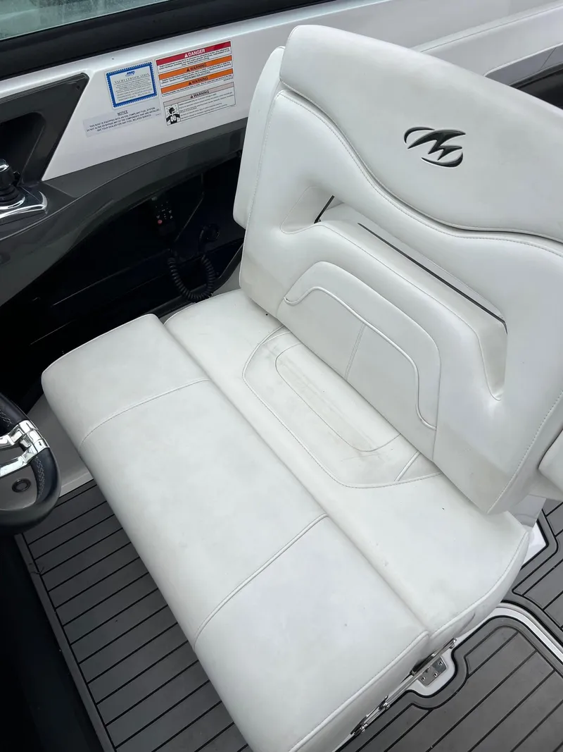 Slide: The Image of 2016 Monterey 328SS boat with white leather seating and logo. - 19