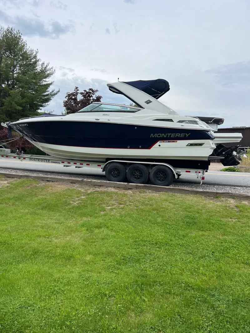 Slide: The Image of 2016 Monterey 328SS boat on a trailer, side view. - 21