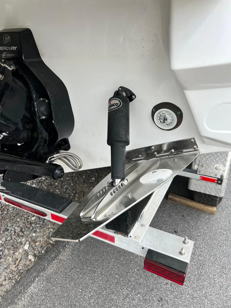 Slide: The Image of 2016 Monterey 328SS boat with Mercury engine and trim tab on trailer. - 25