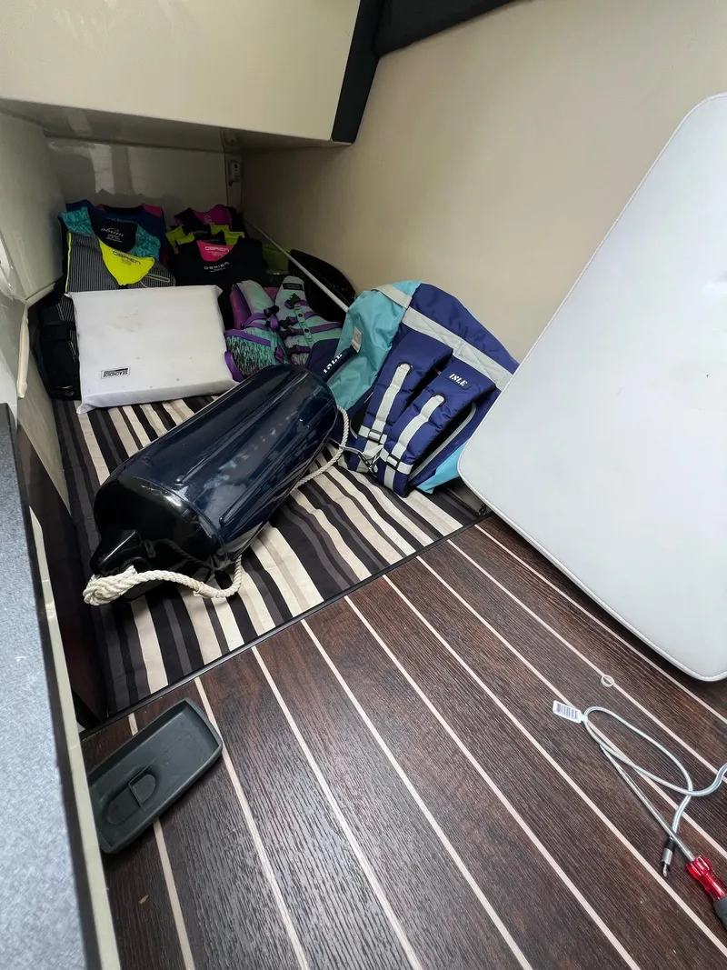 Slide: The Image of Interior storage area of a 2016 Monterey 328SS boat with various gear and accessories. - 3