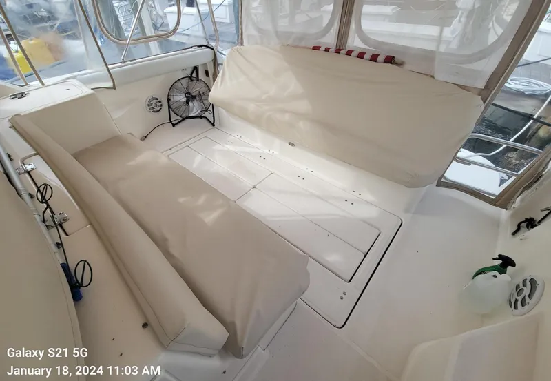 Slide: The Image of Interior seating area of a 1996 Tiara Yachts 4000 Express boat. - 42