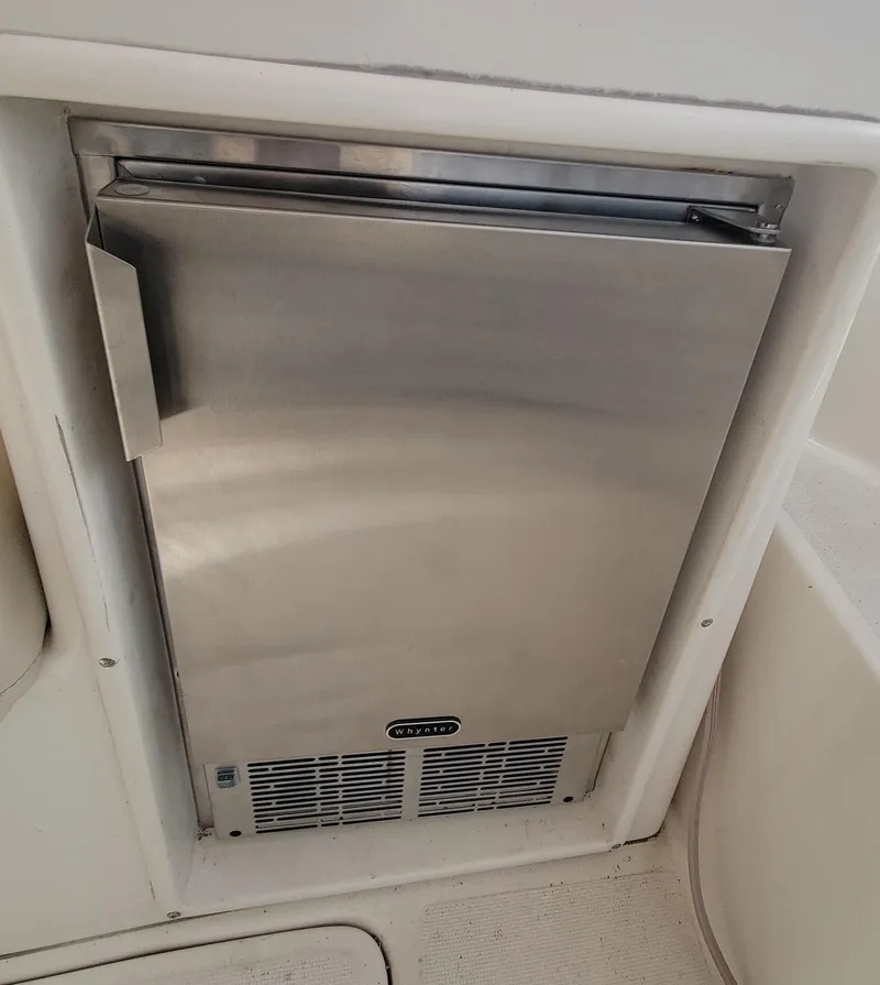 Slide: The Image of Stainless steel refrigerator on a 1996 Tiara Yachts 4000 Express. - 46