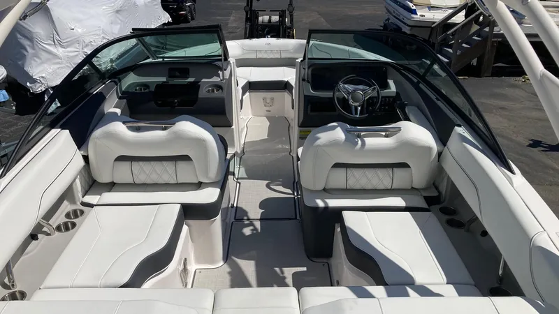 Slide: The Image of 2024 Regal LS2 boat interior with white leather seating and modern dashboard. - 2