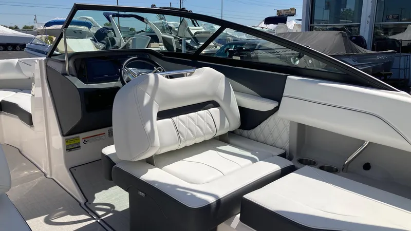 Slide: The Image of 2024 Regal LS2 boat interior with white leather seats and modern dashboard. - 4