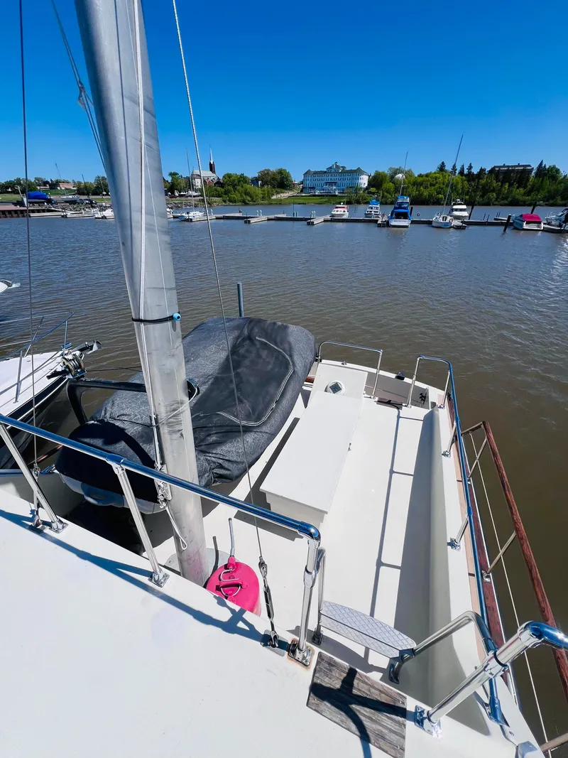 Slide: The Image of 1974 Tollycraft 40 Tri-Cabin Motoryacht docked at a marina under clear blue skies. - 8