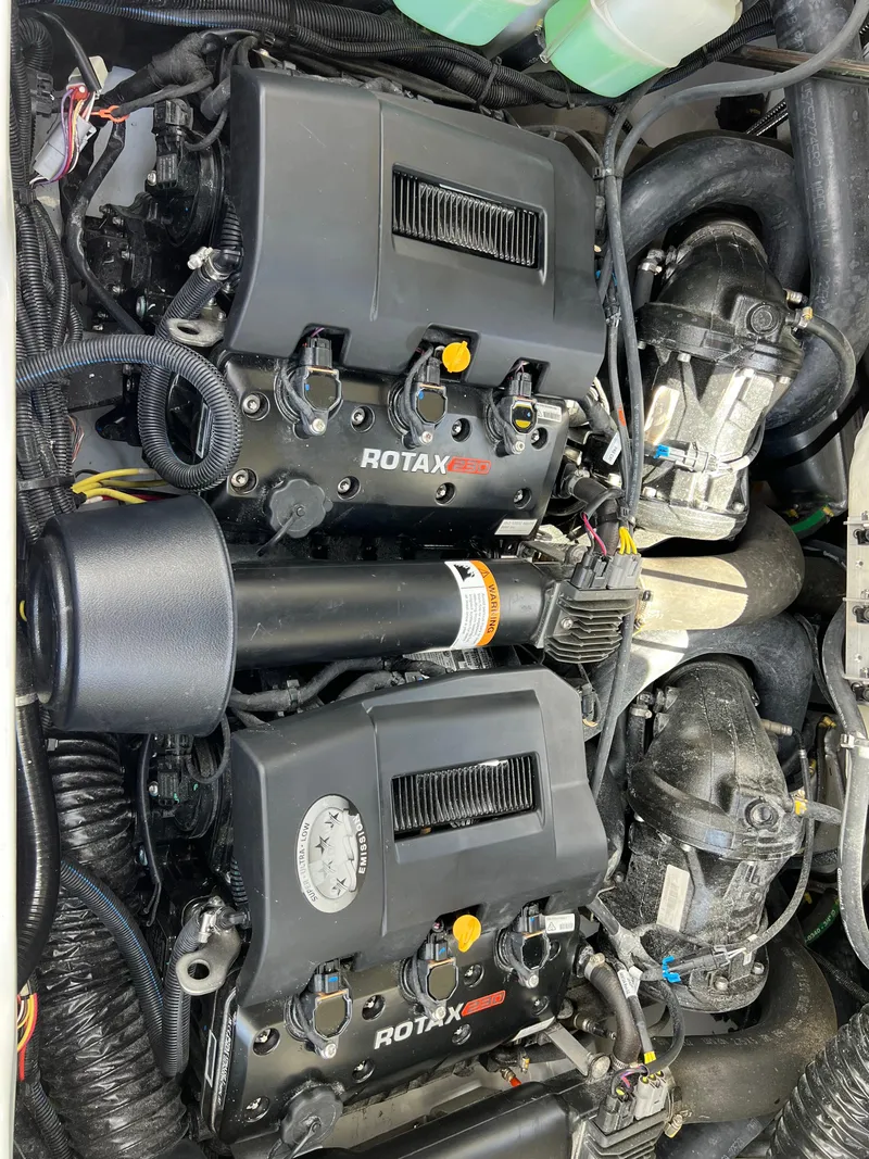 Slide: The Image of 2023 Scarab 255 Wake ID engine compartment with dual Rotax engines. - 10
