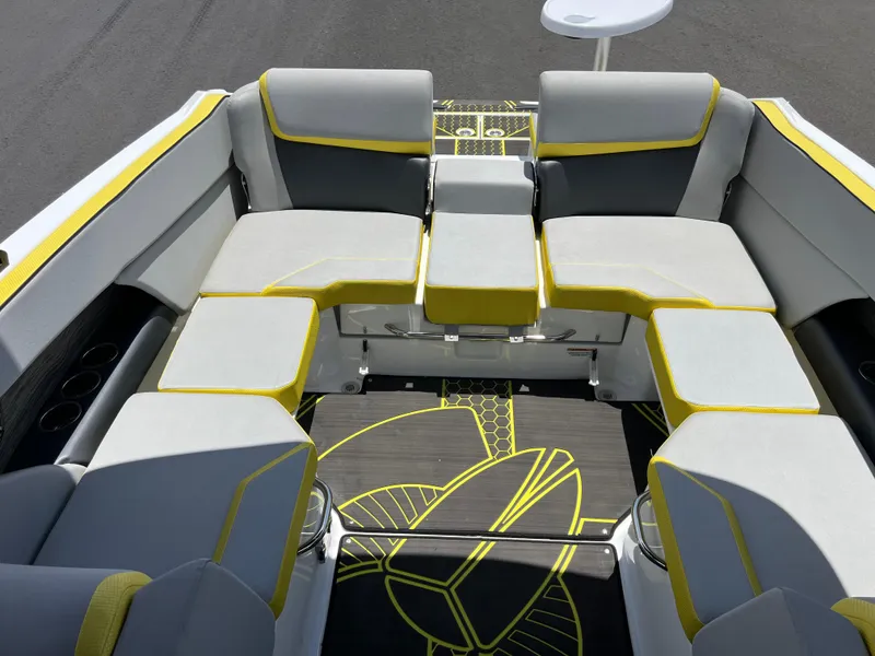 Slide: The Image of 2023 Scarab 255 Wake ID boat interior with gray and yellow seating arrangement. - 12