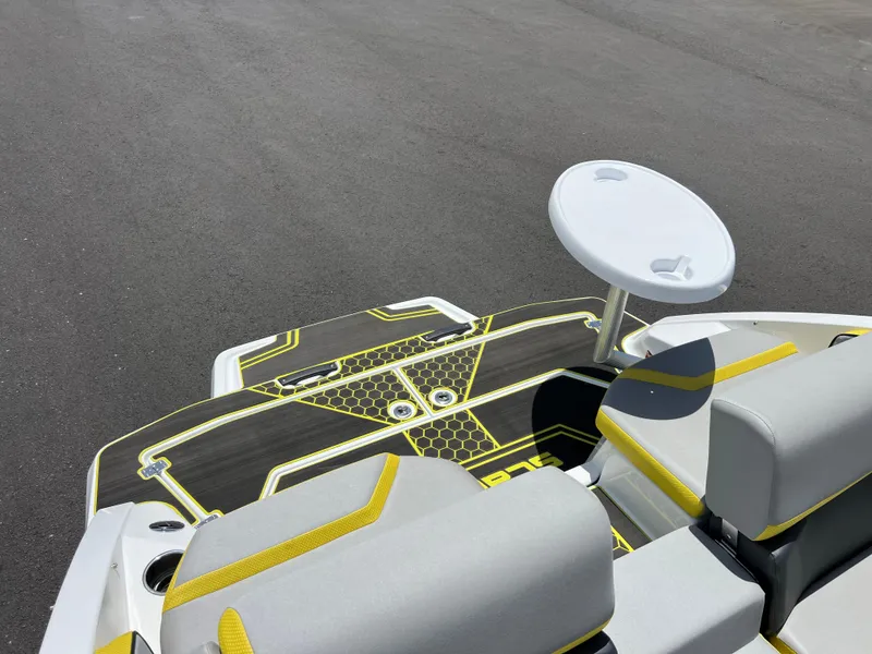 Slide: The Image of 2023 Scarab 255 Wake ID boat interior with stylish seating and table. - 13