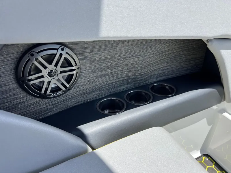 Slide: The Image of 2023 Scarab 255 Wake ID boat interior with speaker and cup holders. - 21