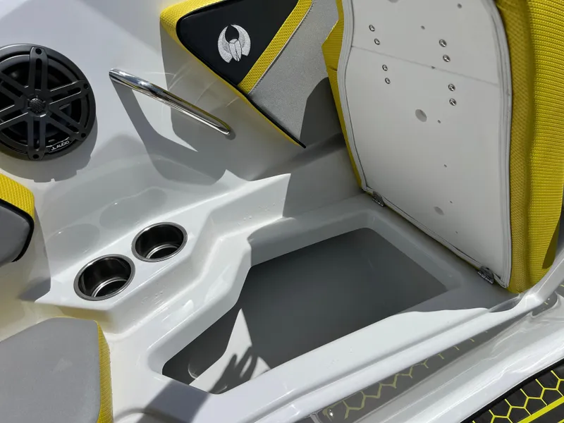 Slide: The Image of 2023 Scarab 255 Wake ID boat interior with speaker, cup holders, and yellow accents. - 27