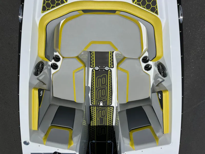 Slide: The Image of 2023 Scarab 255 Wake ID boat interior with yellow and gray seating, top view. - 29