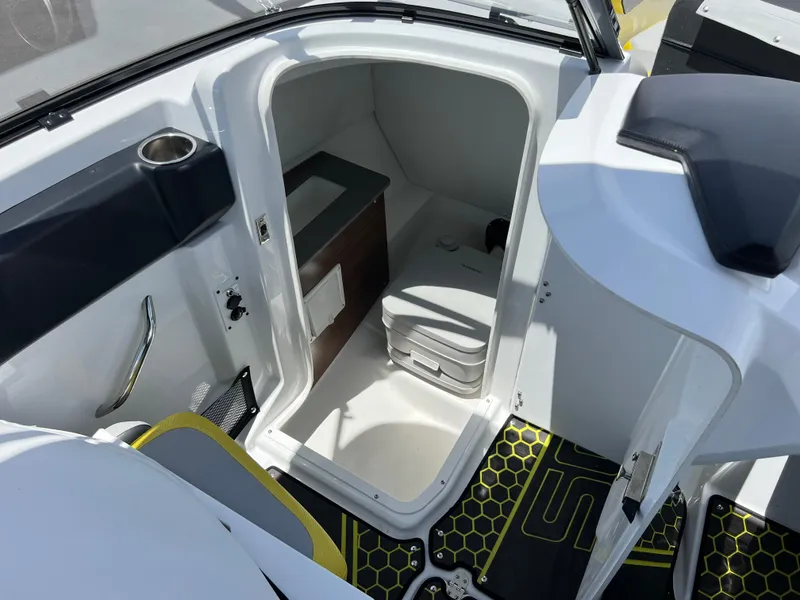 Slide: The Image of 2023 Scarab 255 Wake ID boat interior with compact cabin and seating area. - 31