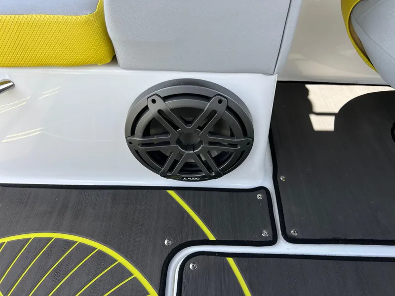 Slide: The Image of 2023 Scarab 255 Wake ID boat interior with speaker and stylish yellow accents. - 39