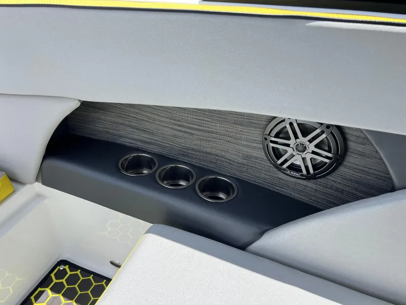Slide: The Image of Interior of 2023 Scarab 255 Wake ID boat with speaker and cup holders. - 40