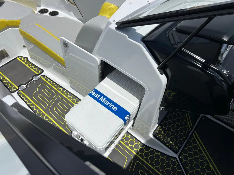 Slide: The Image of 2023 Scarab 255 Wake ID boat interior with storage compartment and marine cooler. - 45