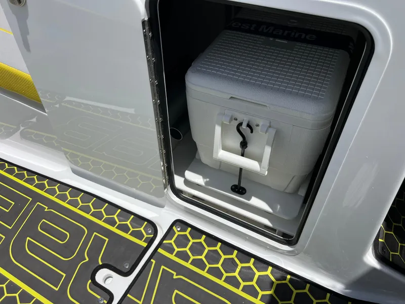 Slide: The Image of 2023 Scarab 255 Wake ID boat storage compartment with cooler. - 46
