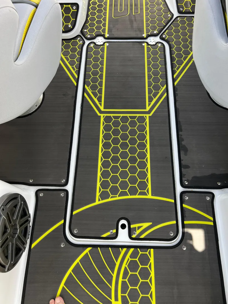Slide: The Image of 2023 Scarab 255 Wake ID boat interior with hexagonal pattern flooring. - 49