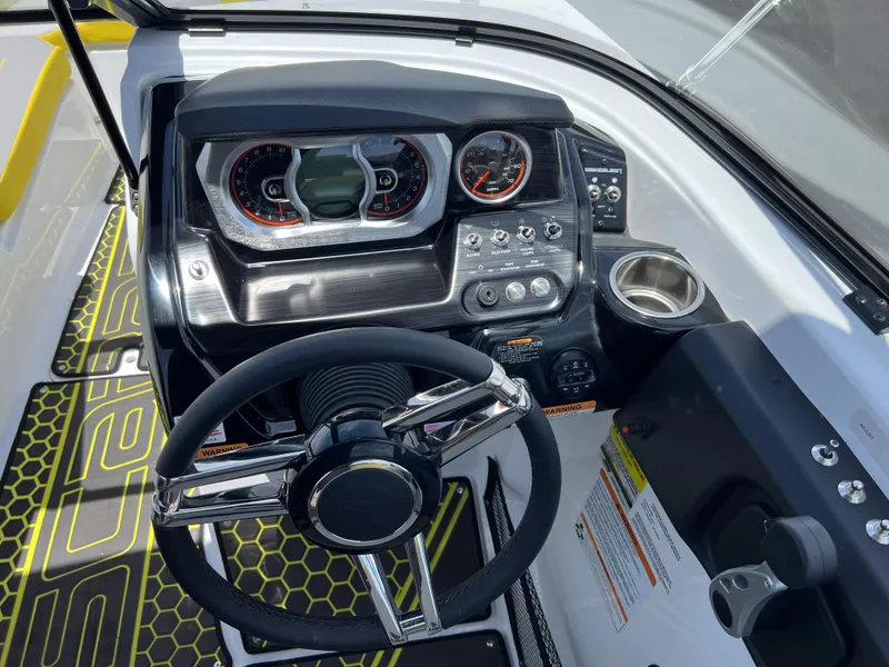 Slide: The Image of 2023 Scarab 255 Wake ID boat dashboard with steering wheel and control panel. - 9