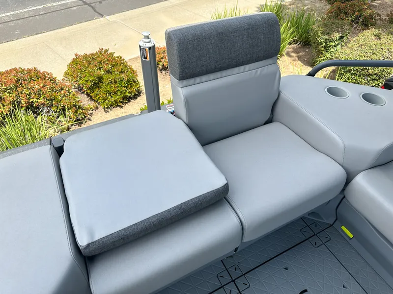 Slide: The Image of 2024 Sea-Doo Switch Sport 21 seating area with gray cushions and cup holders. - 13
