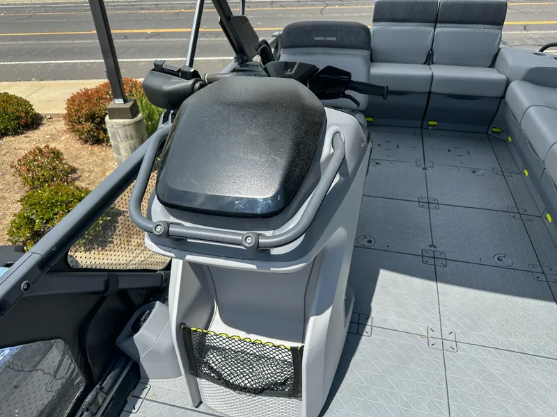 Slide: The Image of 2024 Sea-Doo Switch Sport 21 interior with steering console and seating area. - 17
