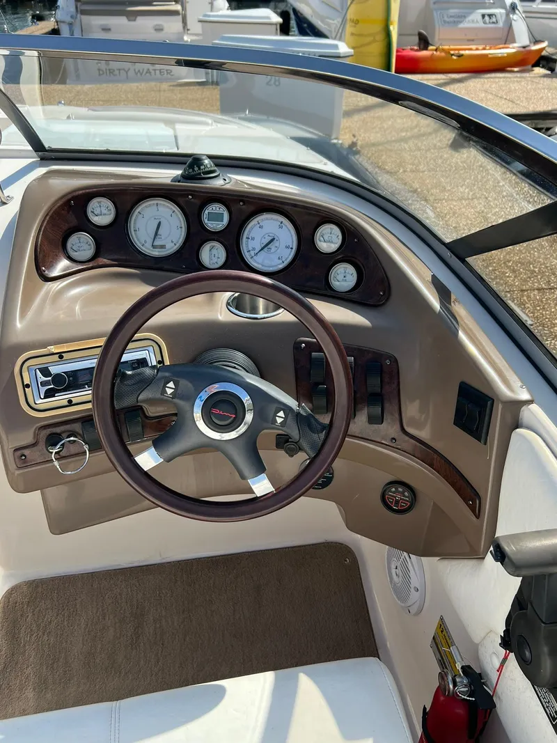 Slide: The Image of 2006 Regal 2600 Bowrider dashboard with steering wheel and instrument panel. - 17