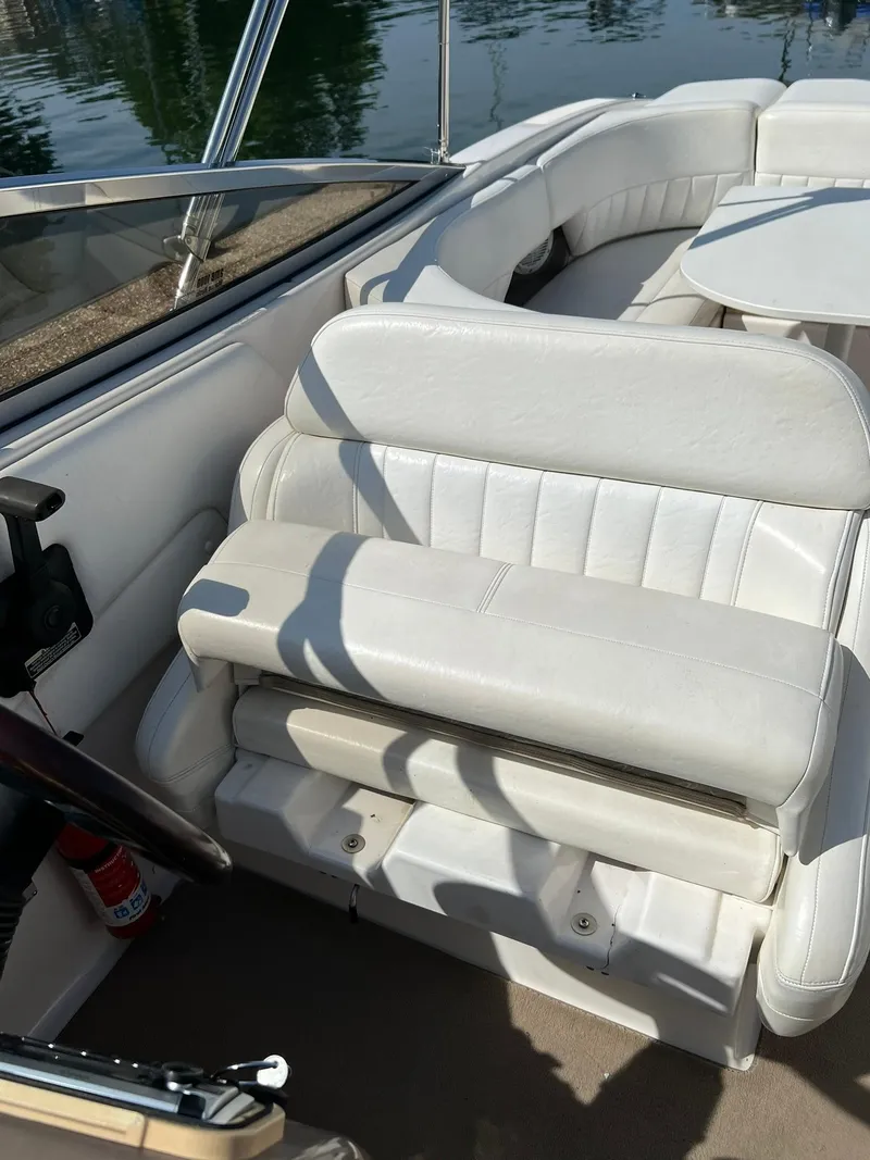 Slide: The Image of 2006 Regal 2600 Bowrider boat interior with white leather seating. - 18