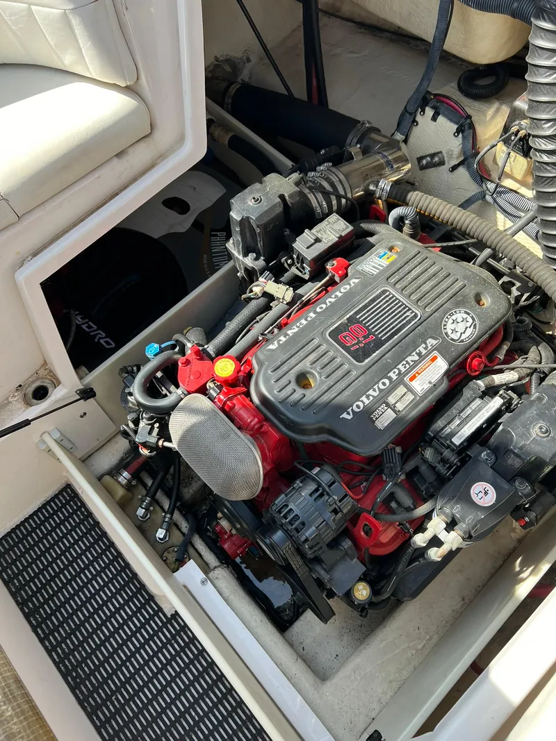 Slide: The Image of 2006 Regal 2600 Bowrider boat engine compartment with Volvo Penta engine. - 24
