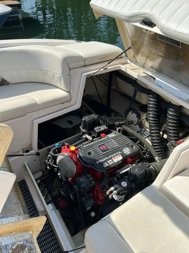 Slide: The Image of 2006 Regal 2600 Bowrider boat engine compartment with open hatch. - 26