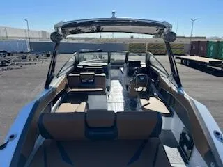 Slide: The Image of 2024 Scarab 285 Wake ID boat interior with seating and helm. - 2