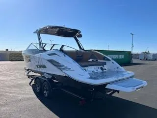 Slide: The Image of 2024 Scarab 285 Wake ID boat on trailer in outdoor setting. - 4