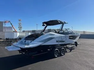 Slide: The Image of 2024 Scarab 285 Wake ID boat on trailer in outdoor lot. - 6