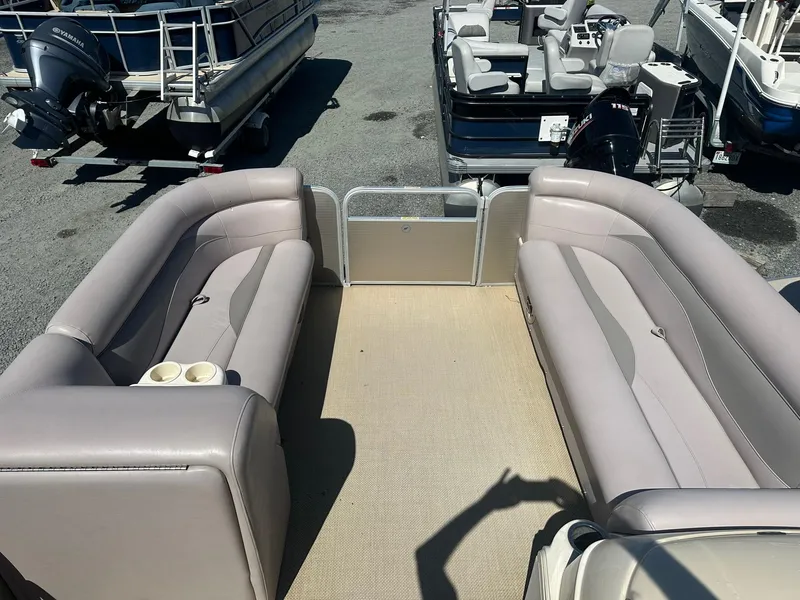 Slide: The Image of 2015 Godfrey 2286 Sweetwater Pontoon boat interior with spacious seating. - 6