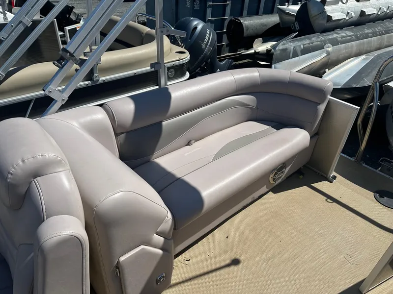 Slide: The Image of 2015 Godfrey 2286 Sweetwater Pontoon with beige seating and spacious deck. - 7