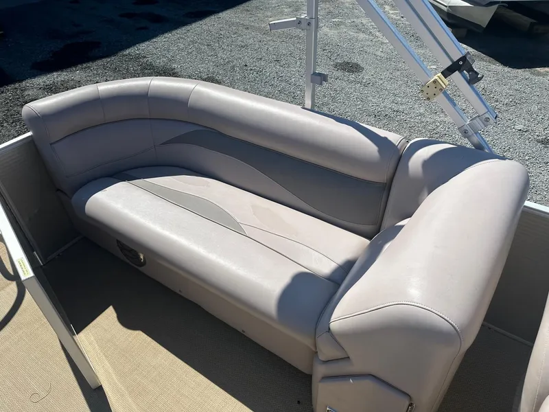 Slide: The Image of 2015 Godfrey 2286 Sweetwater Pontoon boat seating area with beige upholstery. - 8
