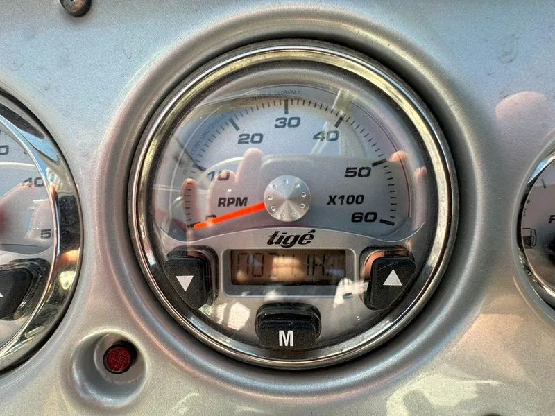 Slide: The Image of Close-up of 2006 Tigé 22i boat RPM gauge displaying 14. - 11