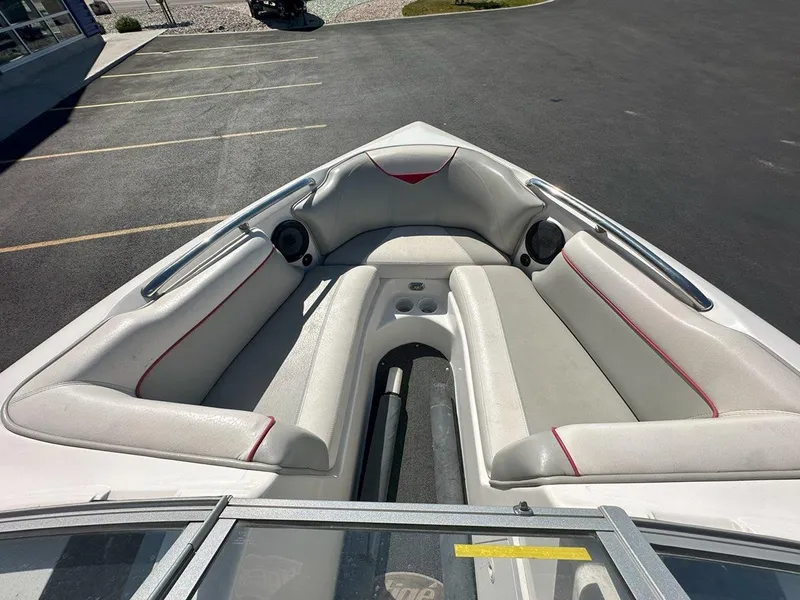 Slide: The Image of 2006 Tigé 22i boat interior with white seating and red accents. - 12