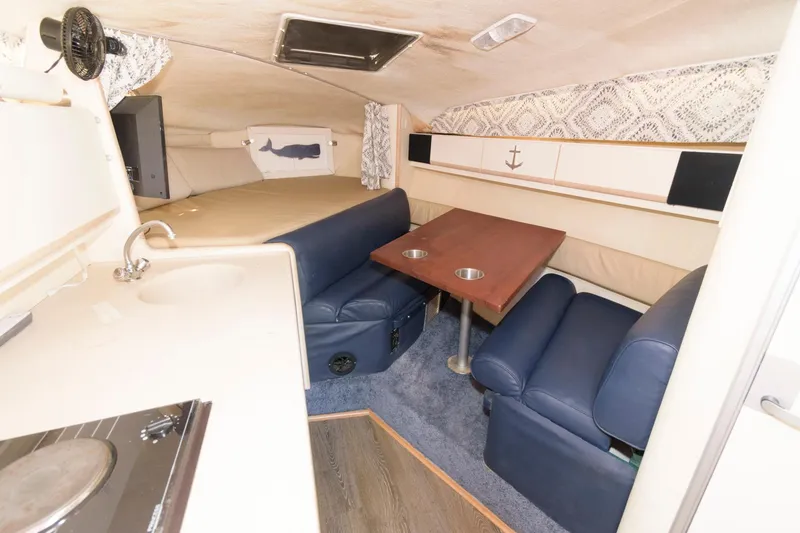 Slide: The Image of Interior of 1995 Wellcraft 2800 Martinique boat with seating and table. - 7