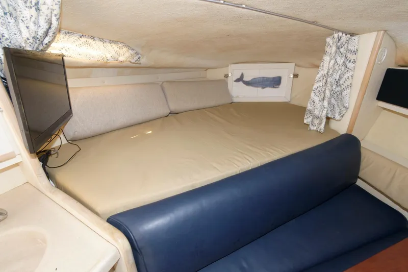 Slide: The Image of Interior cabin of 1995 Wellcraft 2800 Martinique with bed and TV. - 9